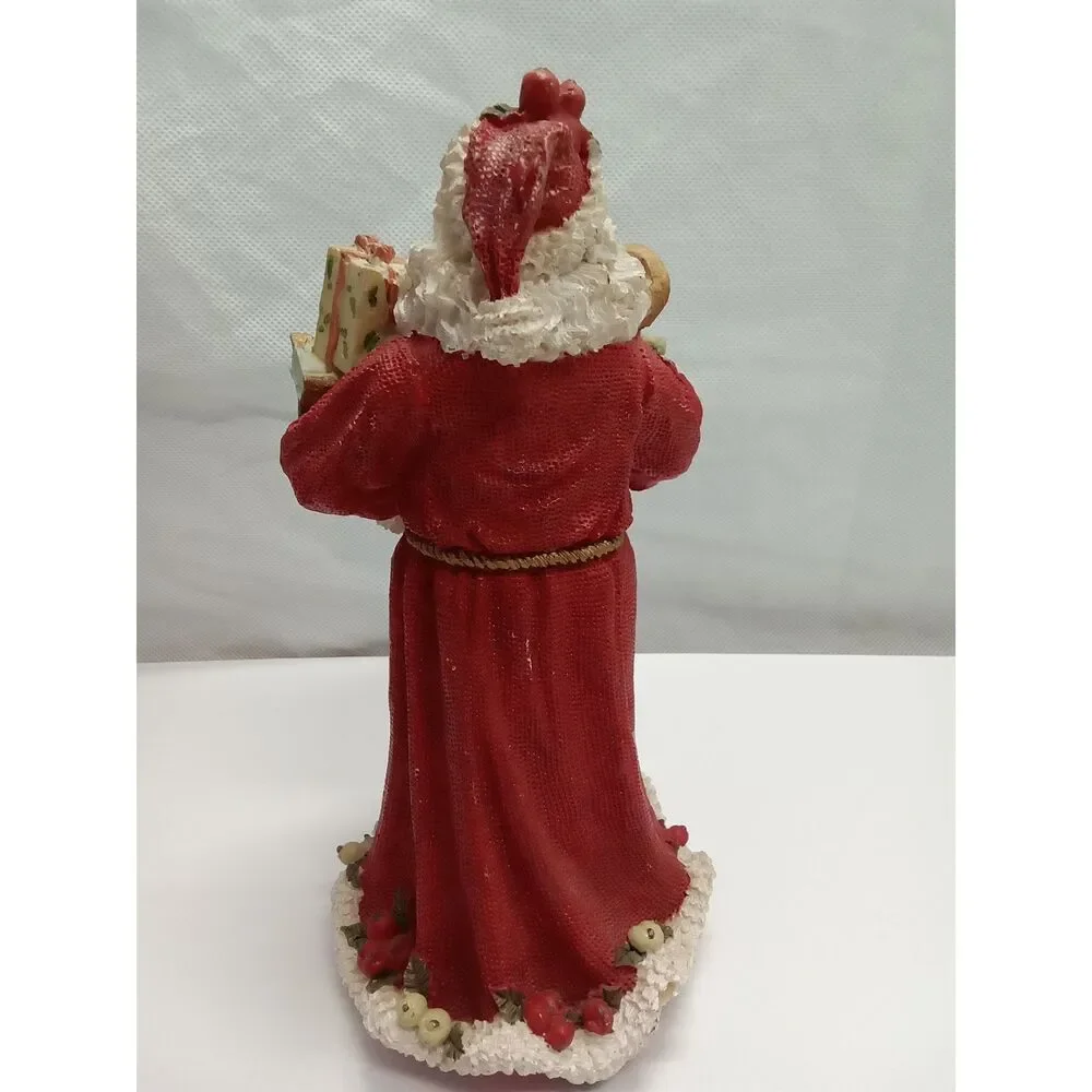 Santa Figurine  ceramic‎ holding gifts appox 9x5x5